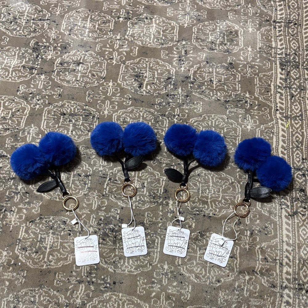 Free People royal blue pom pom keychains set of four